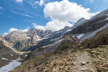 Hiking in Pyrenees mountains. Scenic shot of beautiful landscape with mountain hut near the Rolands Gap.