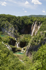 Fototapeta na wymiar Beautiful waterfalls from a hill