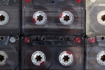 audio tapes are laid close to each other, closeup