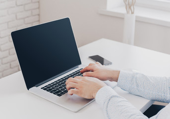 Fototapeta premium Businessman at work. Close-up top view of man working on laptop