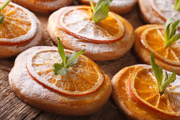 Fototapeta na wymiar Almond cookies with orange and mint on the table. Horizontal 