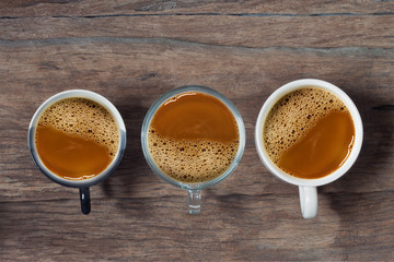Coffee cup top view on old wooden