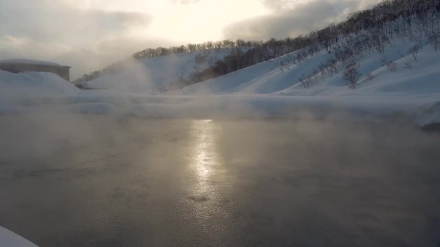 Natural Onsen Hot Spring Outdoors Steam and Sunset in Japan