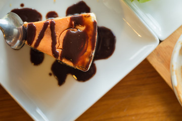 cake with chocolate creame on white plate from top view