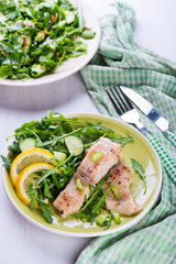 Steamed catfish filet with arugula salad