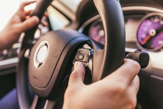 Close-up of a male hand  in a modern car