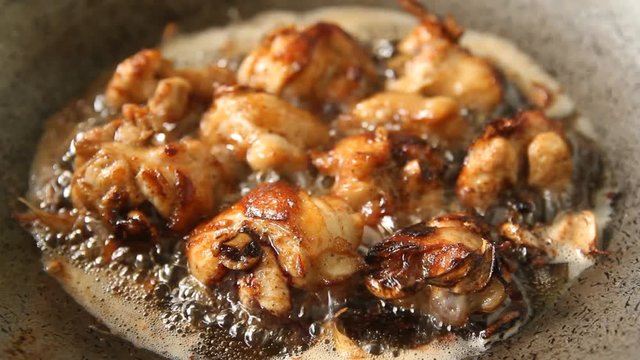 Fried chicken with garlic in wok ( Thai style )
