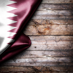 Flag of Qatar on wooden boards