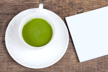 green tea with milk or hot matcha latte with paper