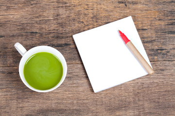 Fototapeta na wymiar green tea with milk or hot matcha latte with paper