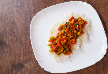 Rice with mixed vegetables on white plate