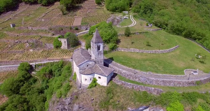 Aerial 4k - Tirano - Valtellina (IT) - Chiesetta di Santa Perpetua (Sec. VI) 