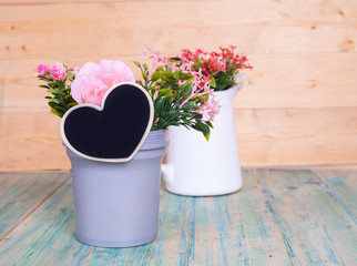 heart shape in vase on wooden table