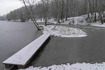 Pedestrian bridges on a the newly frozen pond