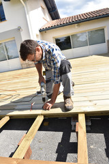 Fototapeta premium Carpenter building wooden deck