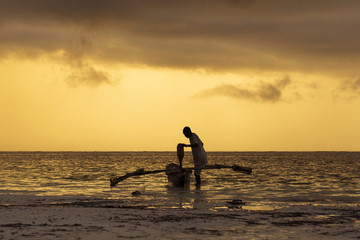 Silhouette of fisherman preparing for fishing at sunrise in Zanz