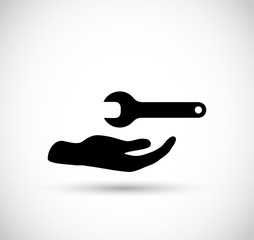 Hand with wrench vector icon