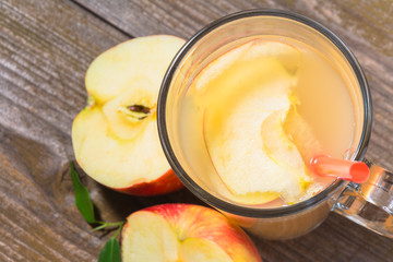 Fresh apple  juice on wooden background