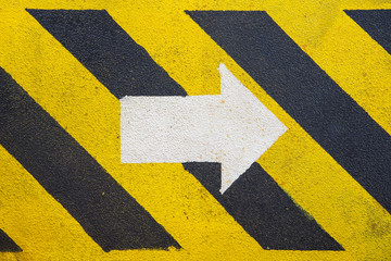 walk way and white arrow sign to indicate the escape route at oil and gas platform