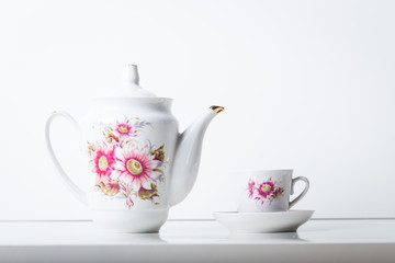 Cup of tea with teapot in vintage style