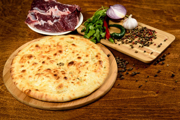 Traditional meat closed pie with spices