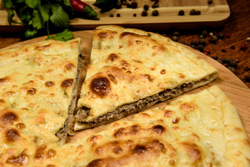 Traditional meat closed pie with spices