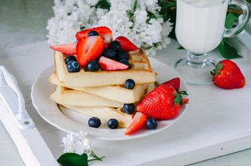 Homemade waffles with berries for breakfast