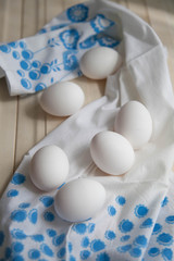 eggs on white wooden table on napkin