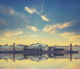 Fototapeta na wymiar Classic view of Saint-Petersburg river scape at sunset. Basil Island in St Petersburg, Russia. Vintage style background.