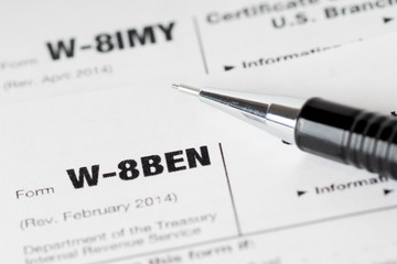 tax forms with black pencil