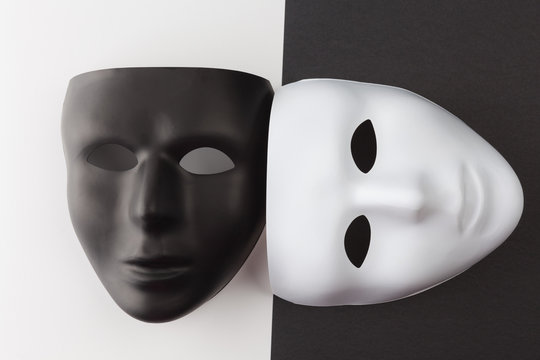 Black and white masks without expression at different angles.