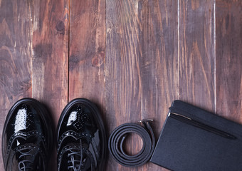 Stylish outfit on wooden bakcground