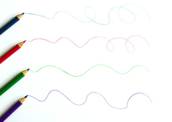 Colour pencils on white background close up