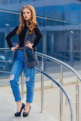 A young girl stands at the business centre.