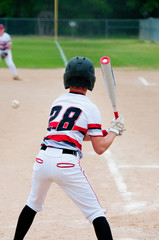 Baseball kid batting