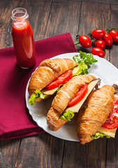 vegetarian croissant cheese breakfast on wood background