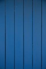 Dark blue wood panels used as background for designer