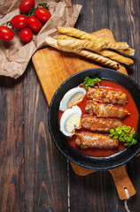 Homemade meat roll on iron pan. Style rustic
