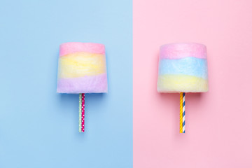 Top view of the Multicolored cotton candy. Minimal style. Pink and blue background