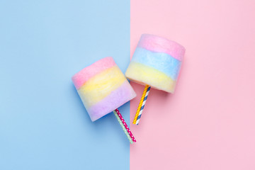 Minimal style. Multicolored Cotton candy. Pastel blue and pink background