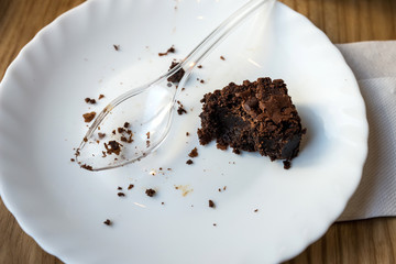 half-eaten brownie on a plate