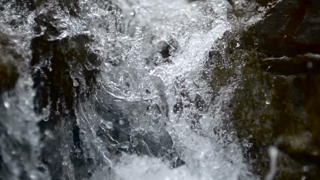 Pure fresh water waterfall in forest in the mountains
