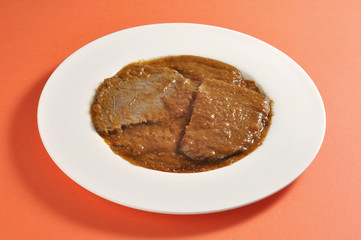 Dish with portion of braised meat