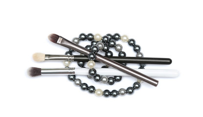Three MakeUp brushes with beading isolated on white background