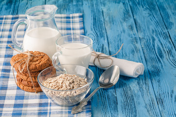 Minimal healthy breakfast with oat and milk glass