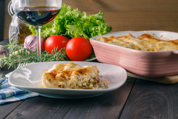 Potion of lasagne on plate