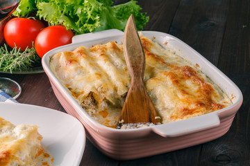 Hot lasagne on table