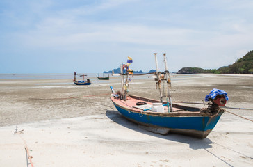 Fototapeta na wymiar Old fishing boat on a beach