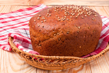 Black bread with fresh coriander closeup