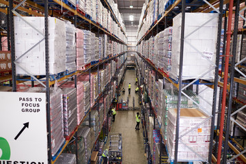 Elevated view of aisle between storage units in a warehouse